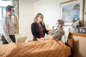 caregivers talking with patient