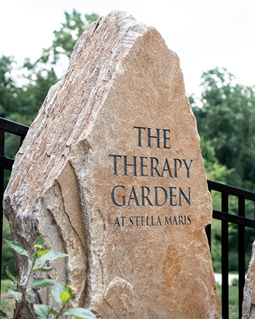 The Therapy Garden rock sign